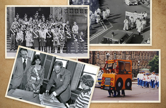 Photo collage of four photos depicting various activities at the CAA Ottawa Jamboree over the years. Top left, black and white photo of a large group of Patrollers wearing their Patrol belts, and police officers, in front of Parliament Hill.  Top right, black and white photo of Patrollers marching behind a police car, carrying a sign.  Bottom left, black and white photo of former Prime Minister Pierre Elliott Trudeau signing a document surrounded by two Patrollers wearing their Patroller belts. Bottom right, colour photo of Patrollers marching in a parade carrying a cut-out school bus prop.