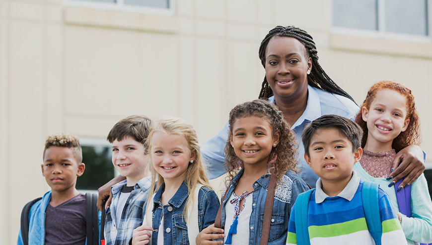 Teacher is walking students safely.