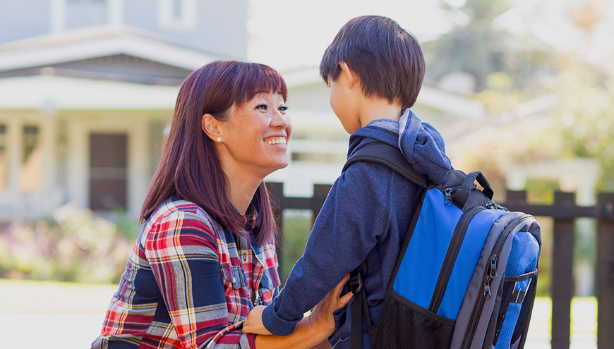 Mother happily talking to her son.